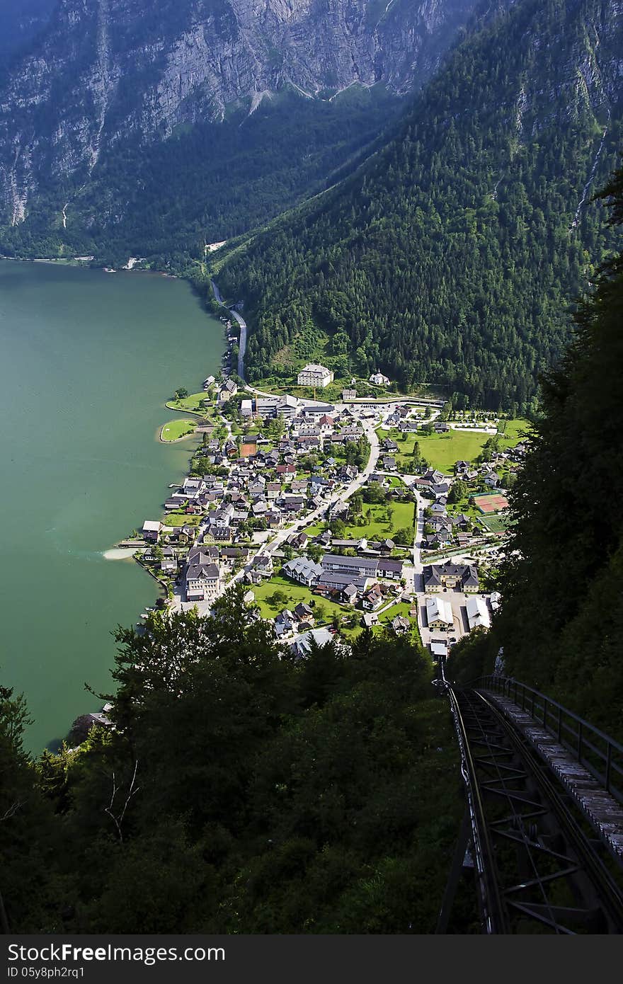 View from the top of the mountain through the railroad track down to the lake Hallstatt Austria