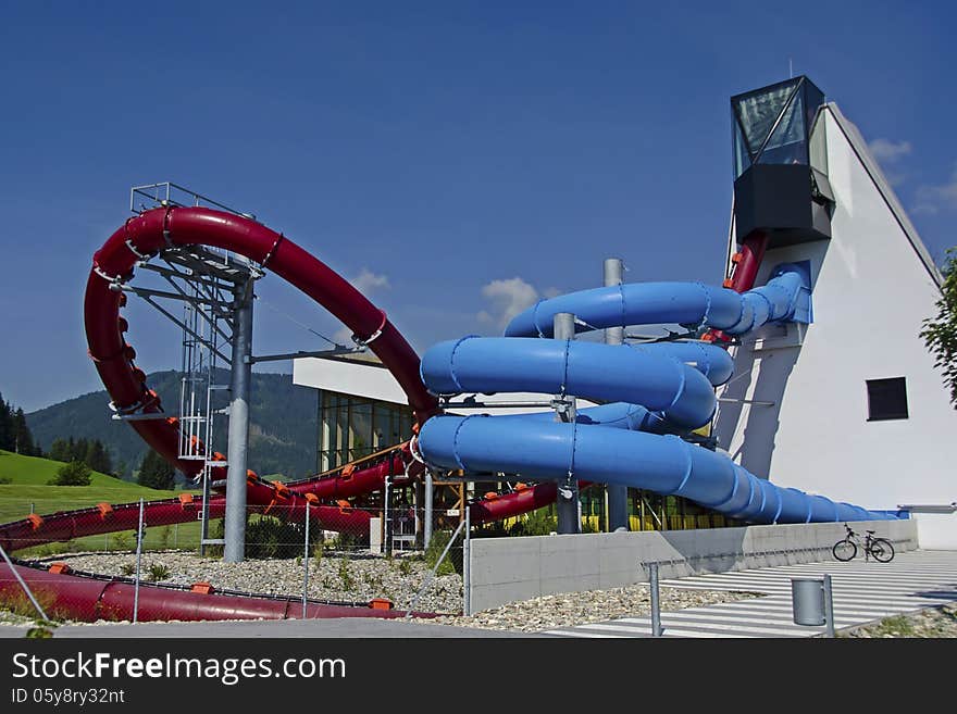 Red and blue water slide in aqua park