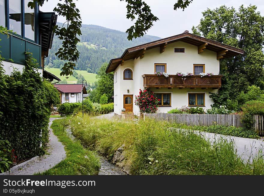 Traditional wooden houses with water stream near by, Austria. Traditional wooden houses with water stream near by, Austria