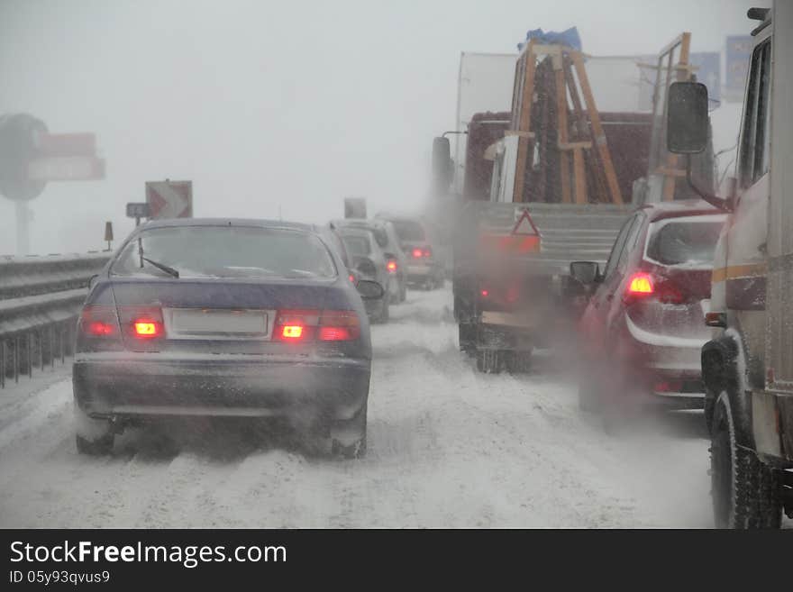 Traffic jam, cars in bad weather.