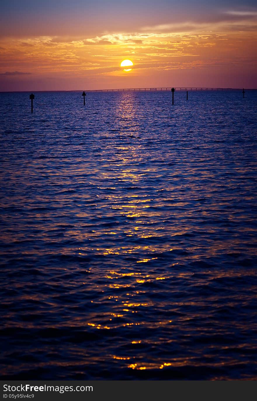 Beautiful golden sunset over the horizon in Destin, Florida