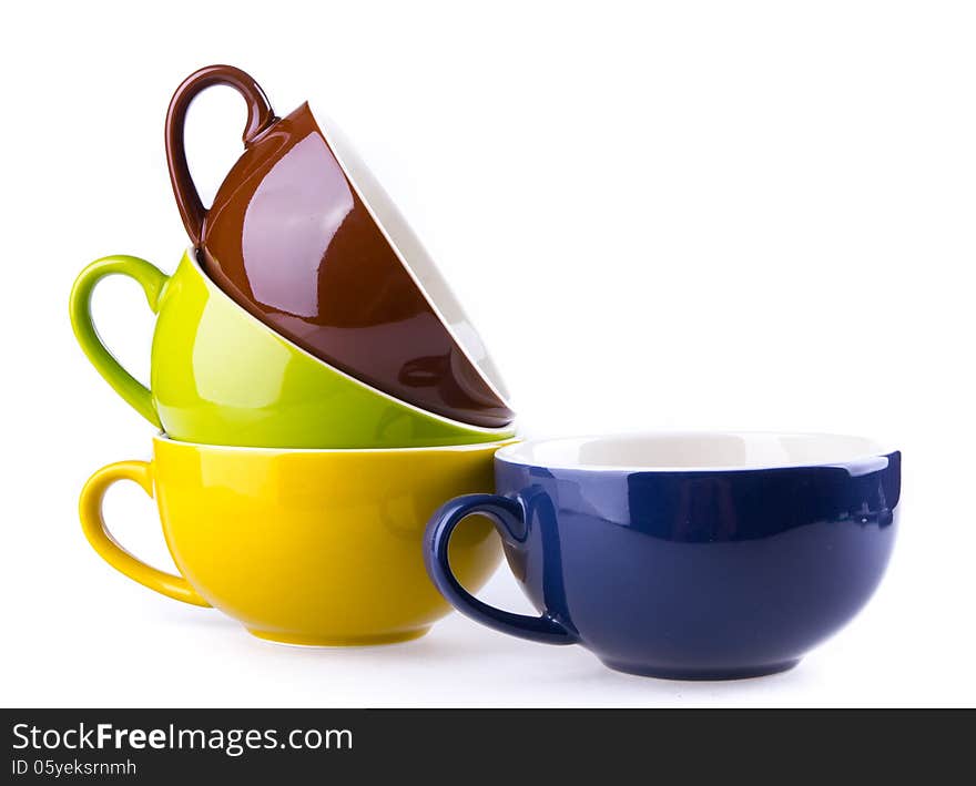 Colorful ceramic cup on white background