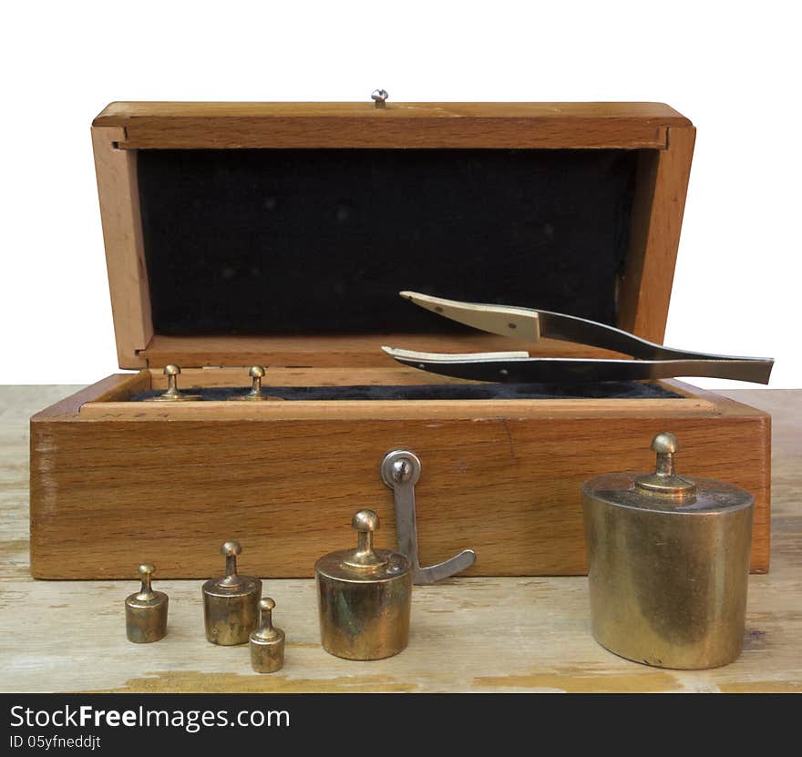 Set of small weights for weighing in a wooden box