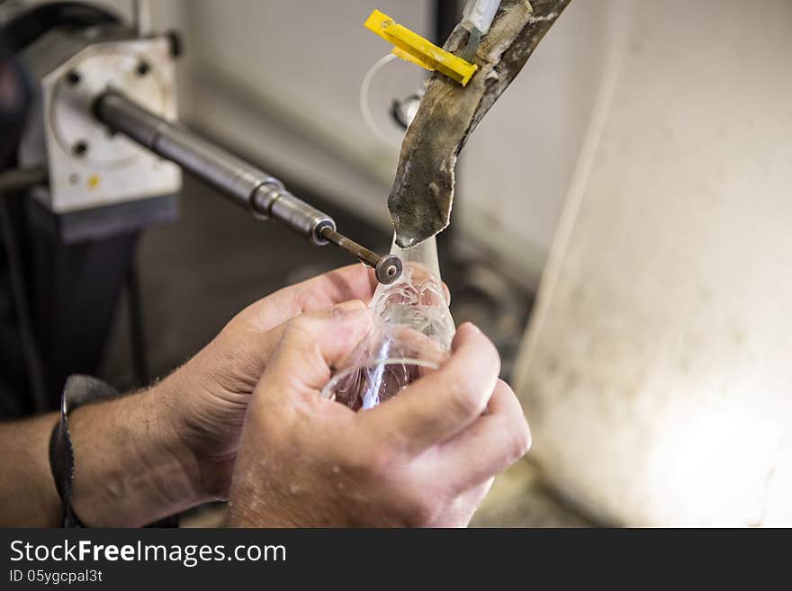 Engraving of glass in the factory.