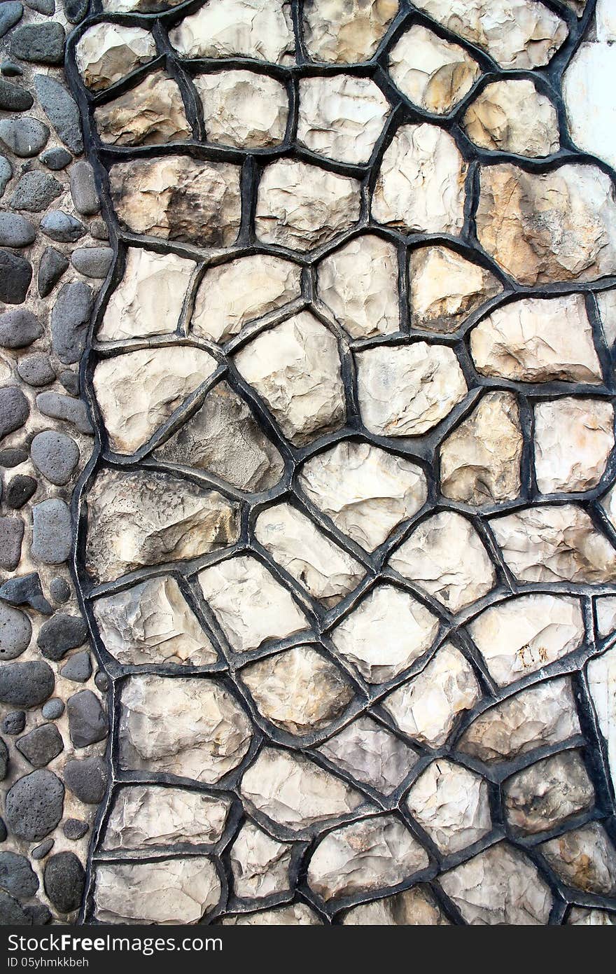 Fragment of an modern handmade stone wall as backgrounds.