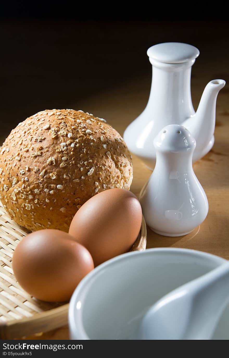 Breakfast set eggs and oat bread.