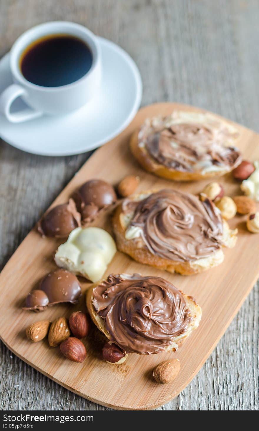 Slices of bread with chocolate cream and nuts