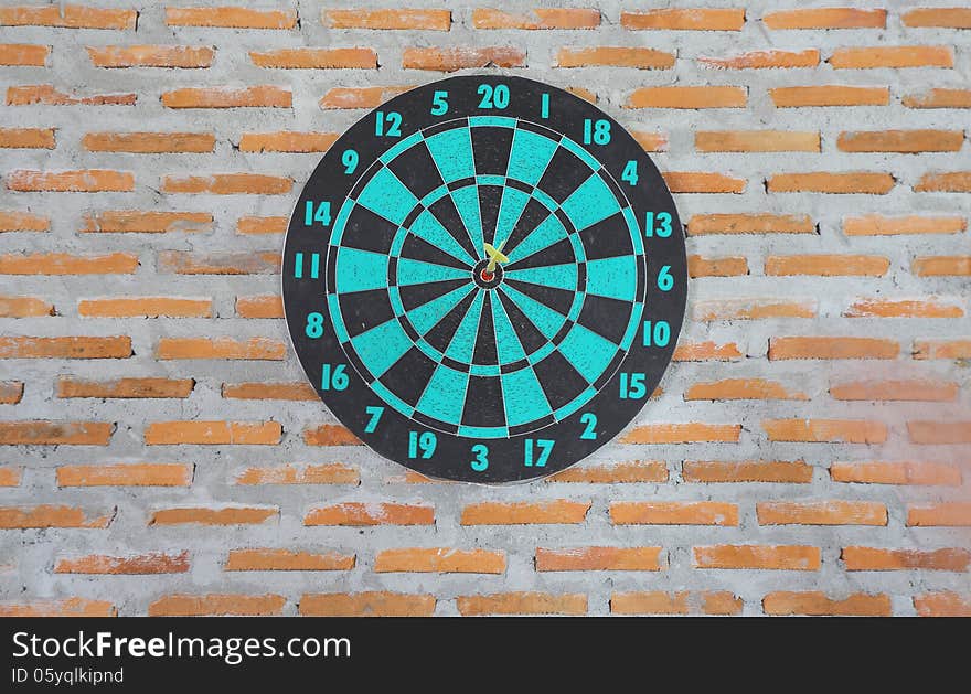 Darts on wall target throw victory