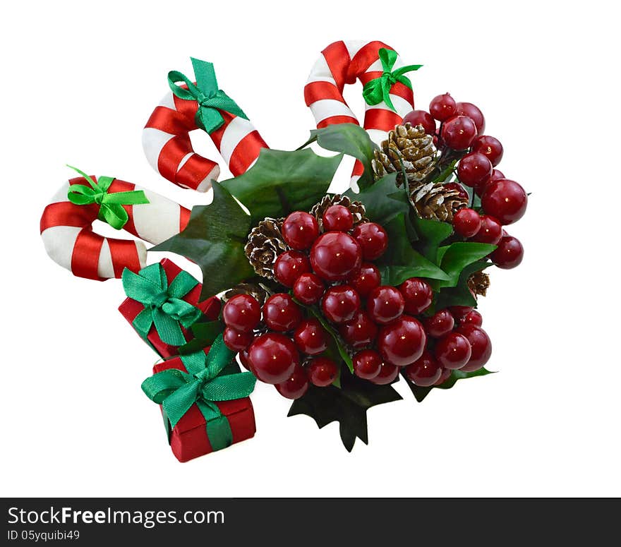 Christmas decoration with bunch of berries, canes and gift boxes isolated