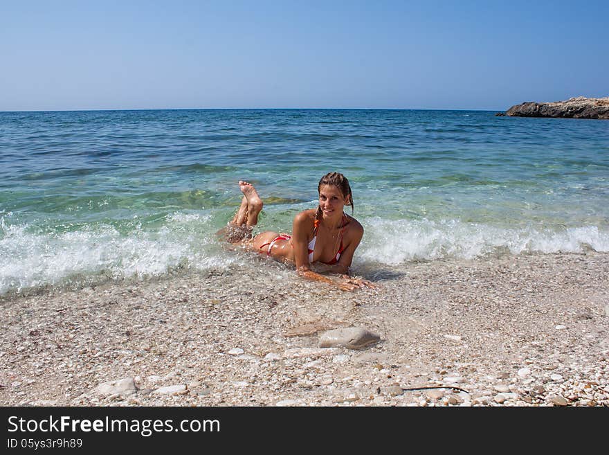 Beautiful young woman enjoying the sea. Beautiful young woman enjoying the sea