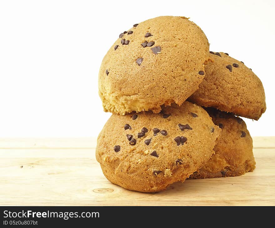 Pile of four tasty bun on wood floor in white background. Pile of four tasty bun on wood floor in white background