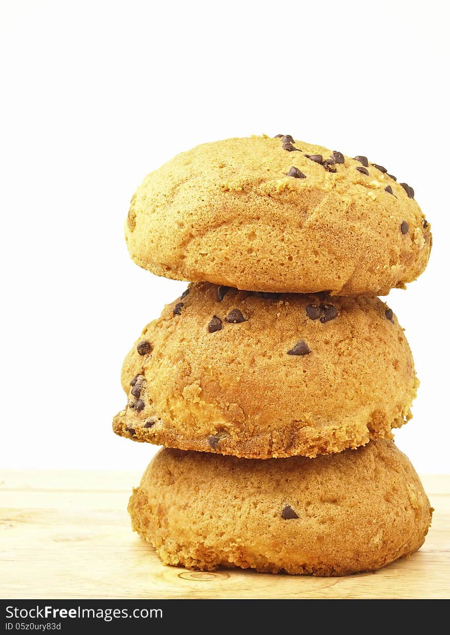 Stack of three tasty bun on wood floor in white background. Stack of three tasty bun on wood floor in white background