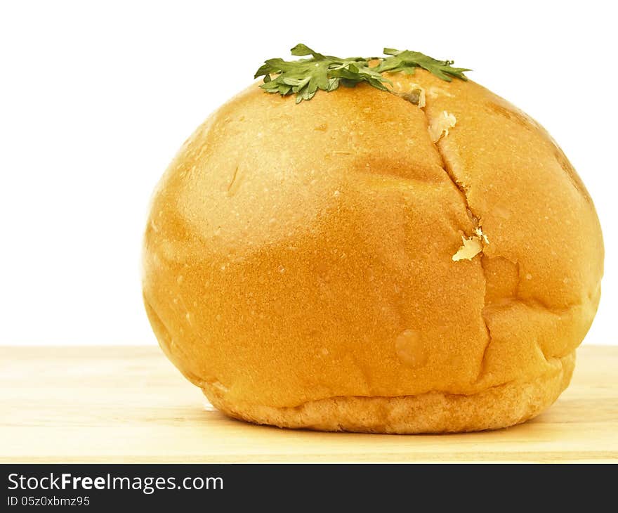 Piece of shred chicken mayo bread on wood floor in white background