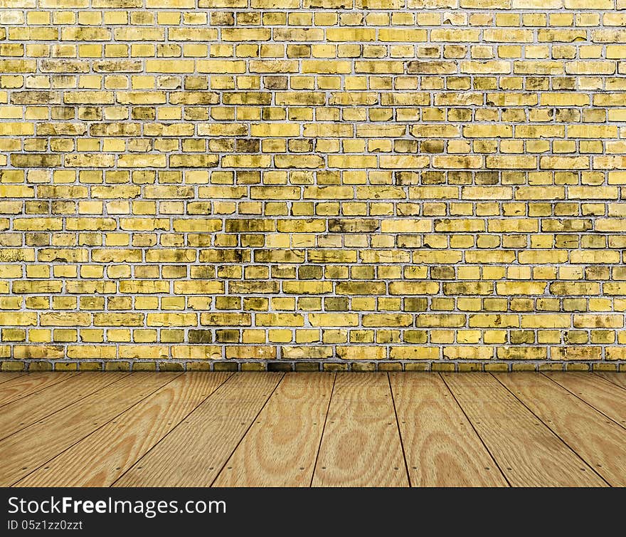 Indoor background with yellow brick wall and wooden plank floor.