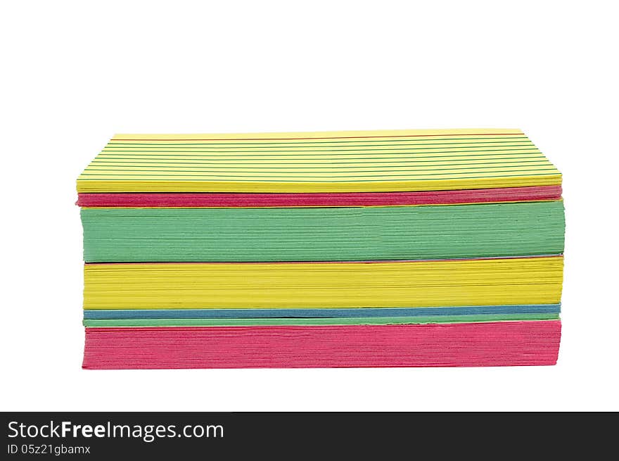 Stack of brightly colored index cards, slightly worn and isolated on white. Horizontal shot. Stack of brightly colored index cards, slightly worn and isolated on white. Horizontal shot.