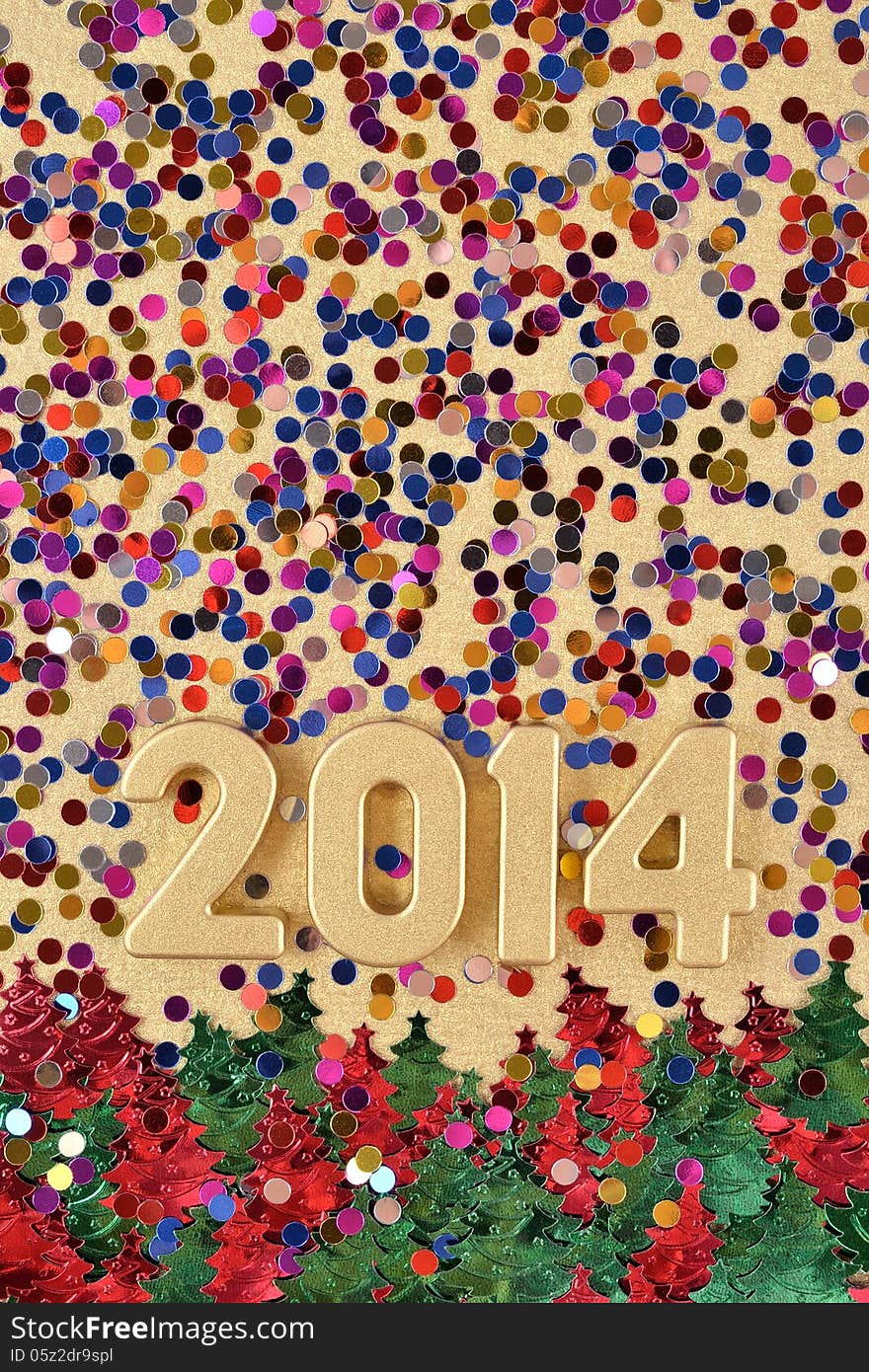 2014 year golden figures on the background of varicolored confetti