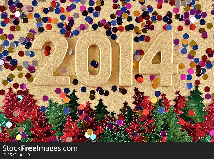 2014 year golden figures on the background of varicolored confetti