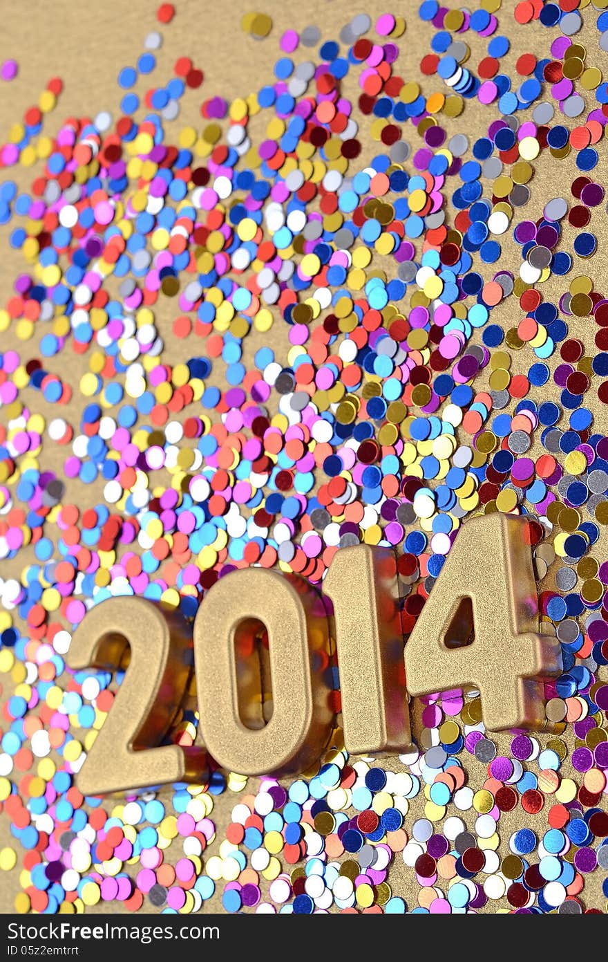 2014 year golden figures on the background of varicolored confetti