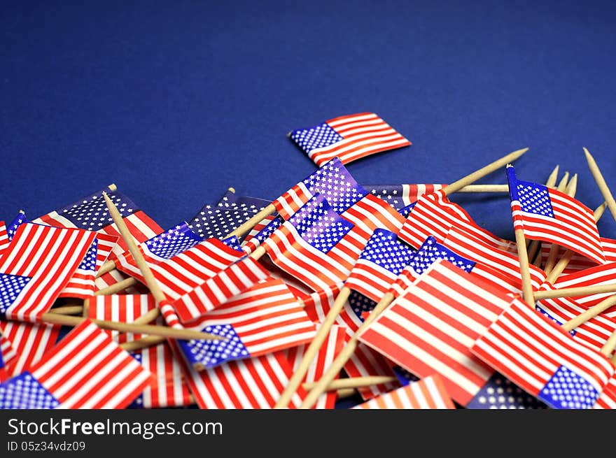 Abstract background of USA Stars and Stripes, red white and blue national toothpick flags for national emblem or public holiday event. Close up with copy space for your text here. Abstract background of USA Stars and Stripes, red white and blue national toothpick flags for national emblem or public holiday event. Close up with copy space for your text here.