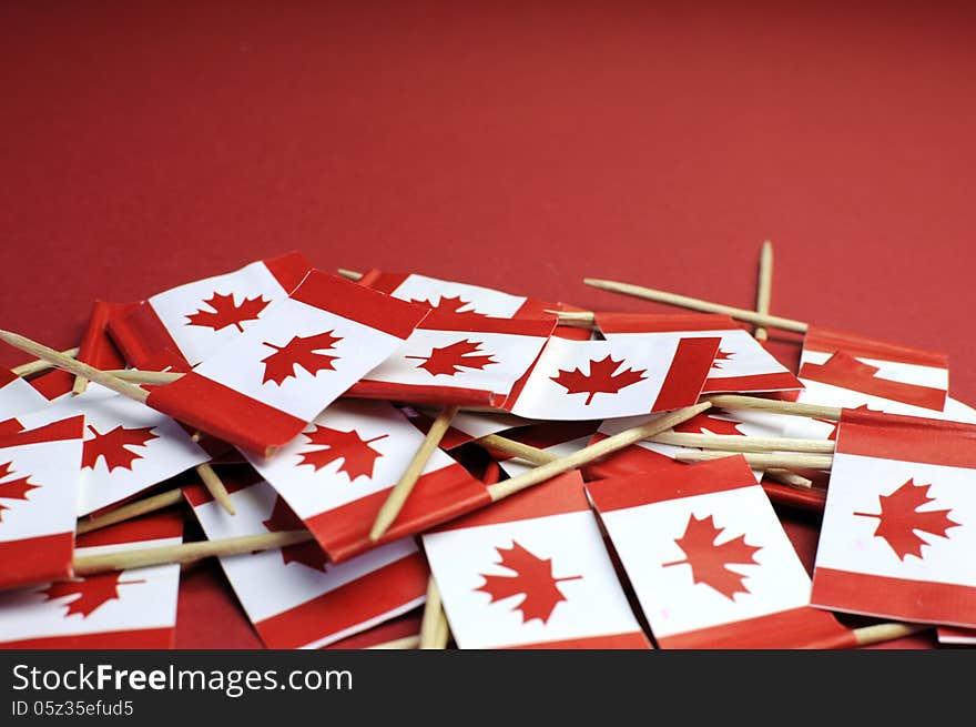 Abstract background of Canada red and white Maple Leaf national toothpick flags for national emblem or public holiday event, with copy space for your text here.