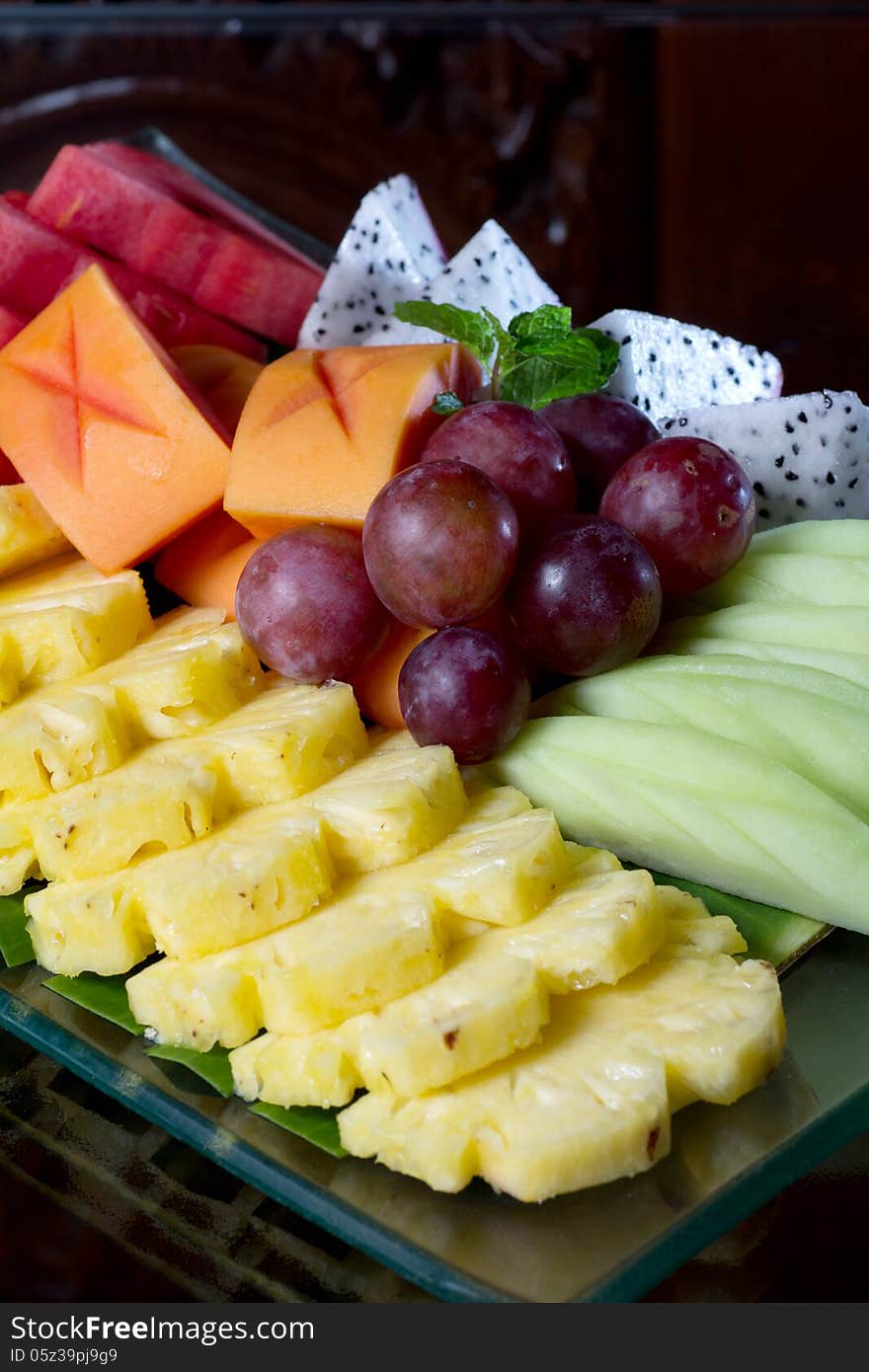 Fresh asian fruit peeled pineapple papaya grape. Fresh asian fruit peeled pineapple papaya grape