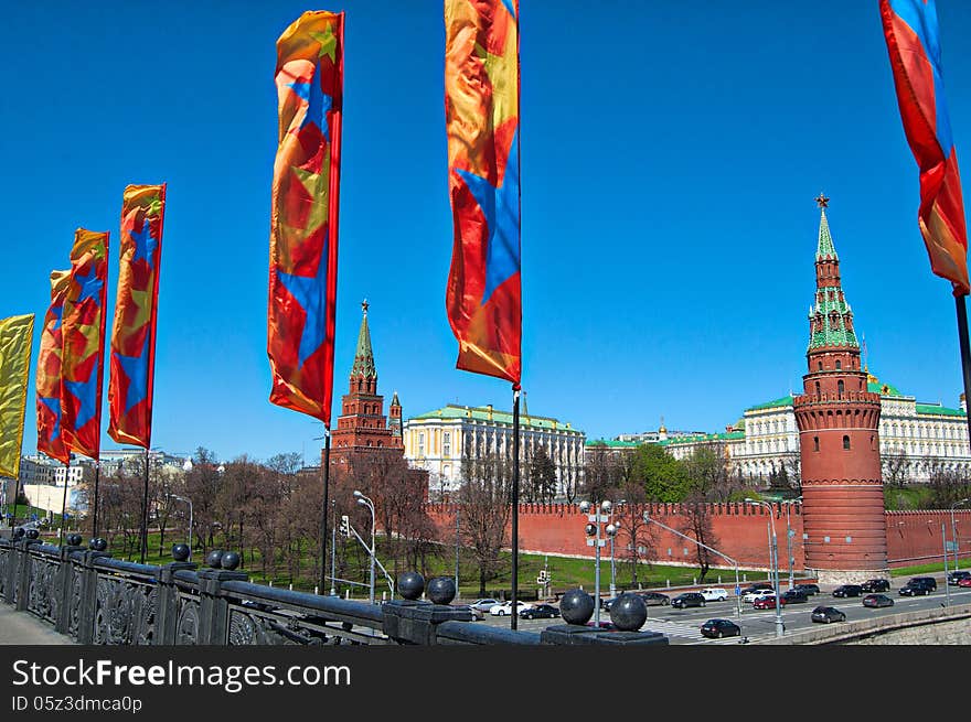 Moscow Kremlin at national holiday with flags on the street