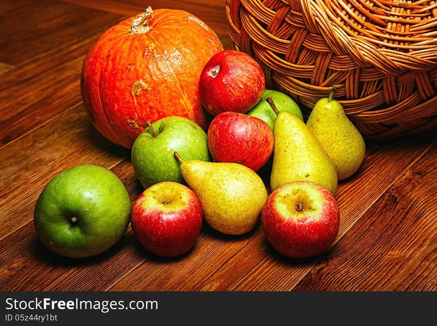 Harvest of ripe fruits and vegetables: apples, pears and pumpkin. Harvest of ripe fruits and vegetables: apples, pears and pumpkin