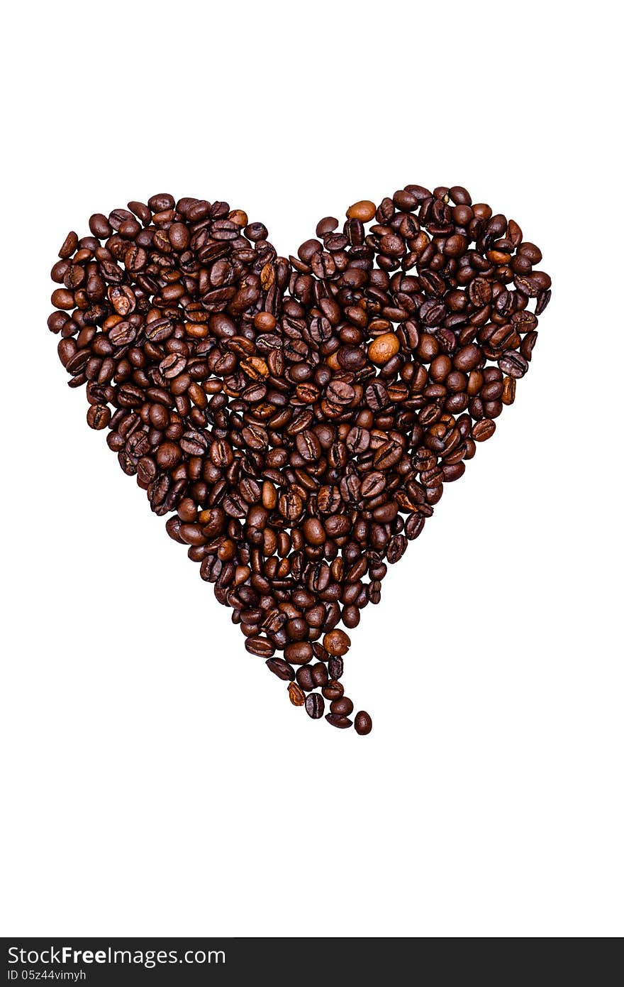 Coffee beans laid out a heart isolated on white background