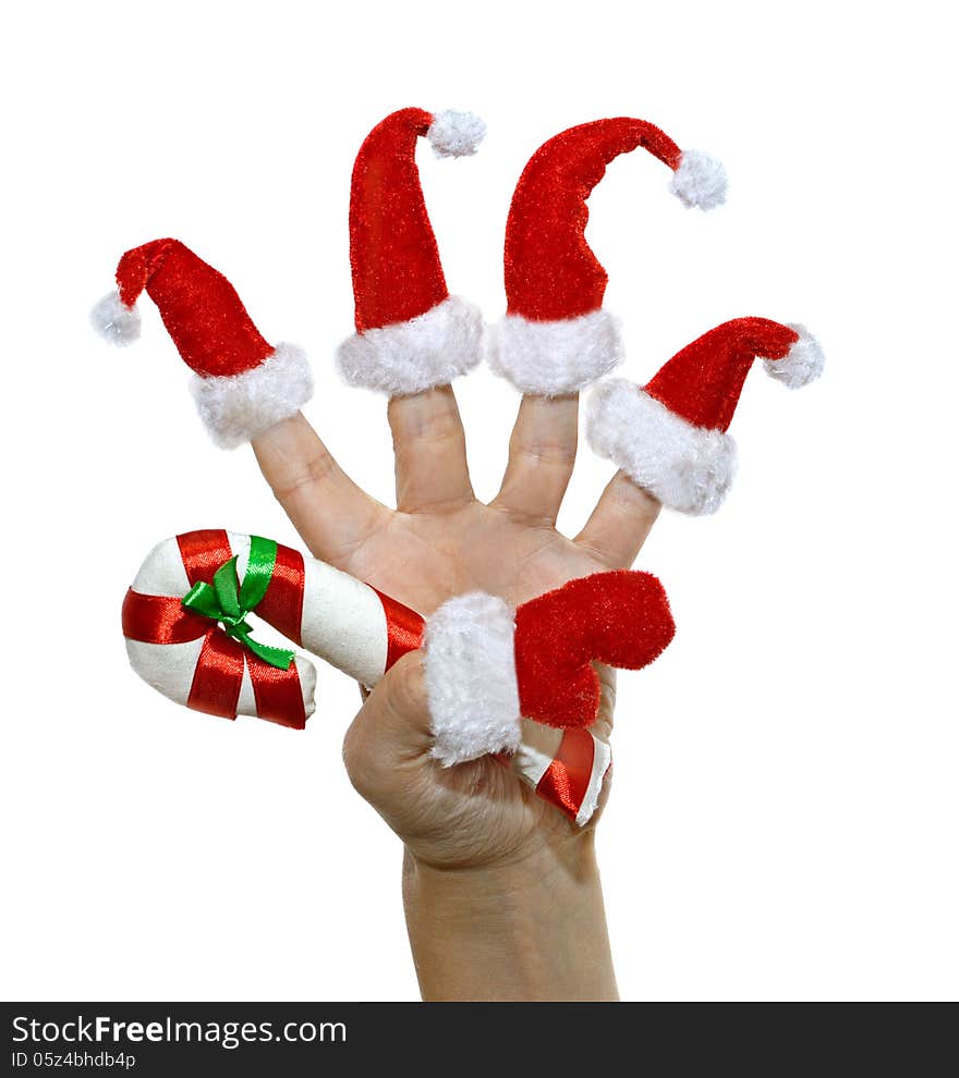 Hand with red furry finger hats and Christmas cane isolated. Hand with red furry finger hats and Christmas cane isolated