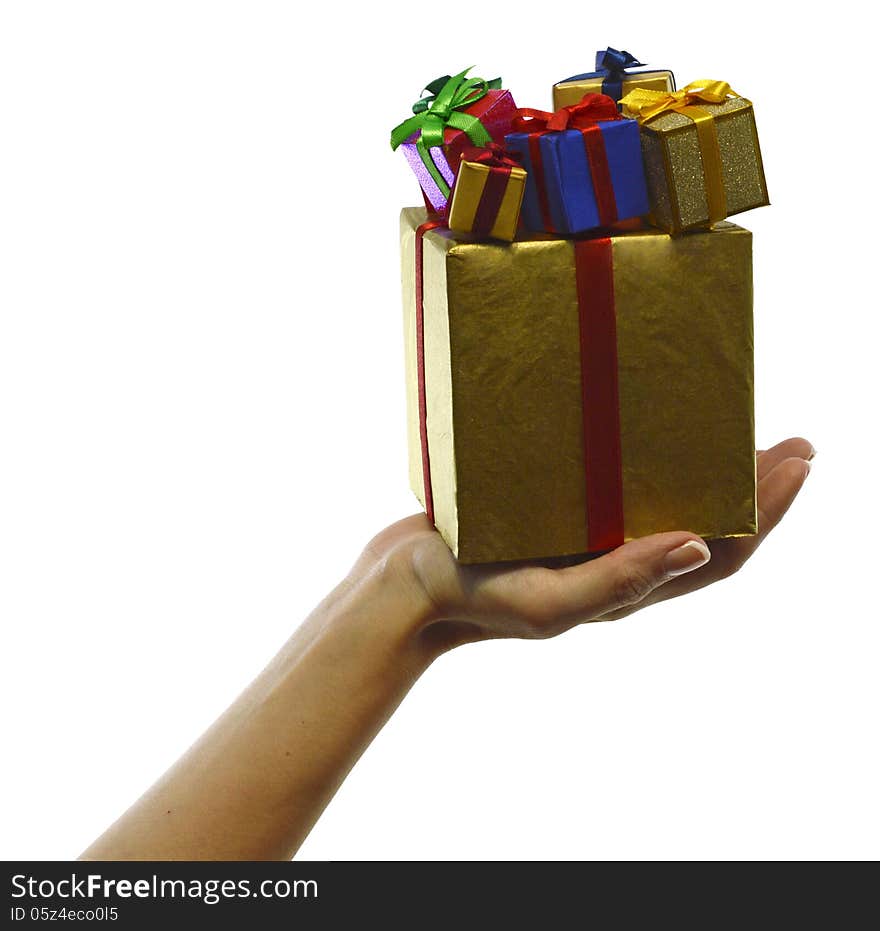 Hand with big golden box and small colorful boxes isolated. Hand with big golden box and small colorful boxes isolated