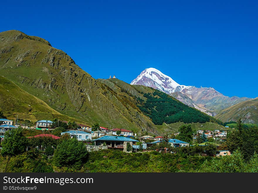 Mountain Kazbek and village Stepantsminda in Georgia. Mountain Kazbek and village Stepantsminda in Georgia