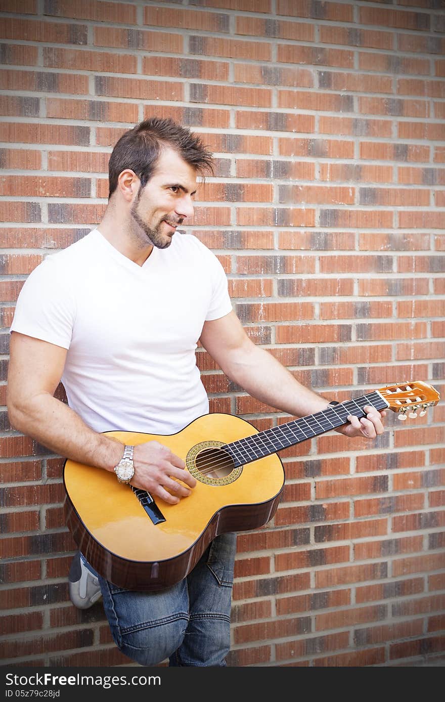 Artist playing guitar.