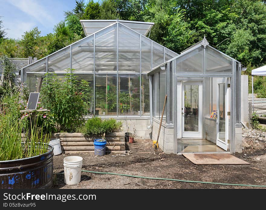 Greenhouse in garden center with trees