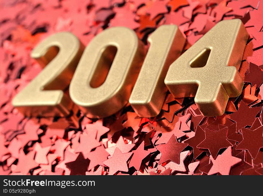 2014 year golden figures on the background of red stars