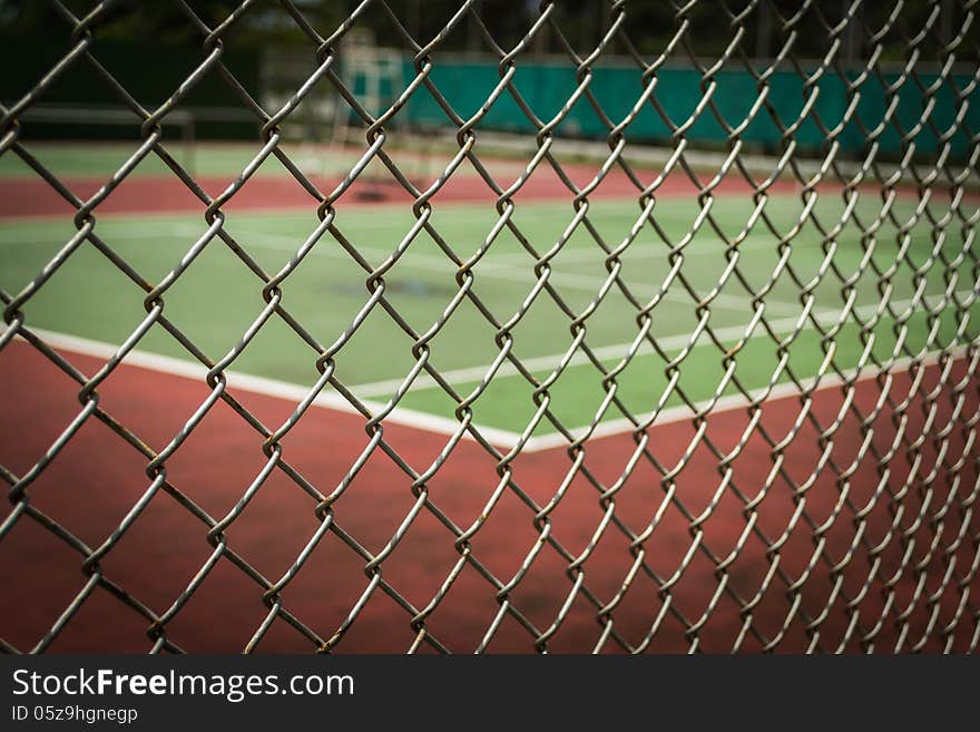 Tennis Court In Metal Fence