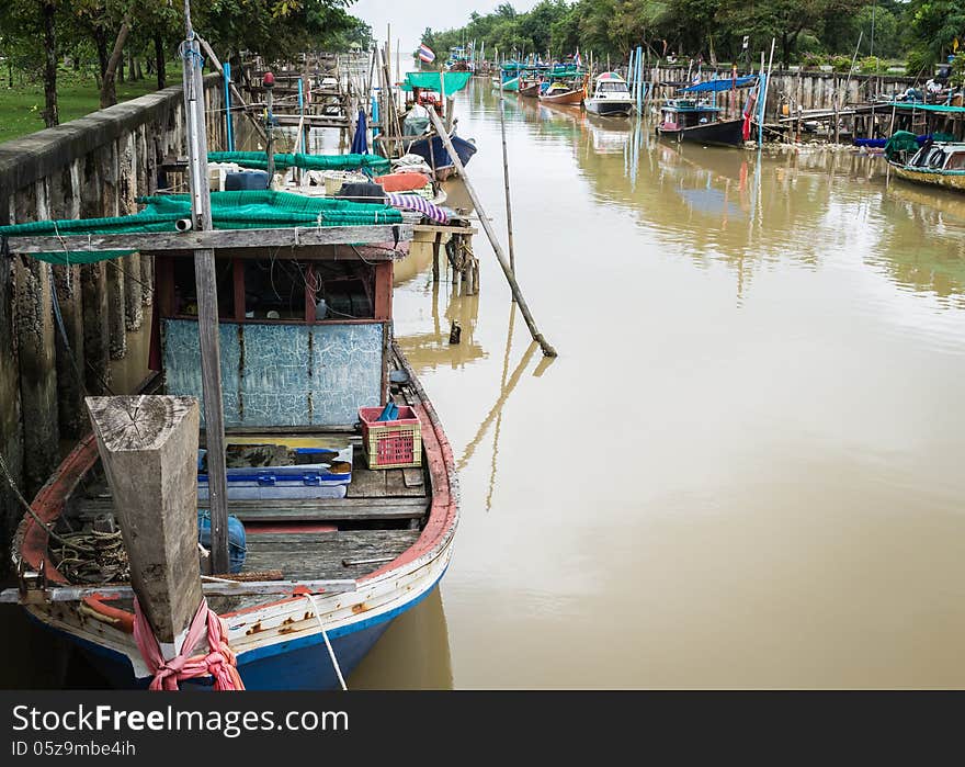 Wooden fishing boats in the canal