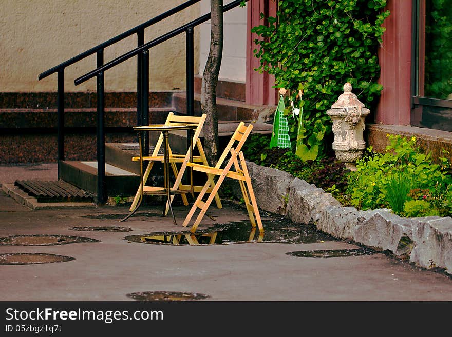 Street cafe with two chairs and little table