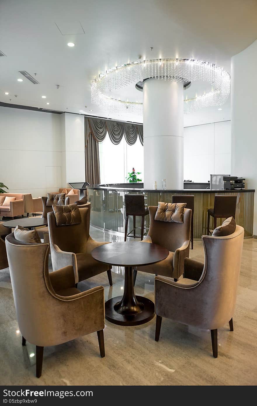 Interior of a bar with leather chair and small tables. Interior of a bar with leather chair and small tables