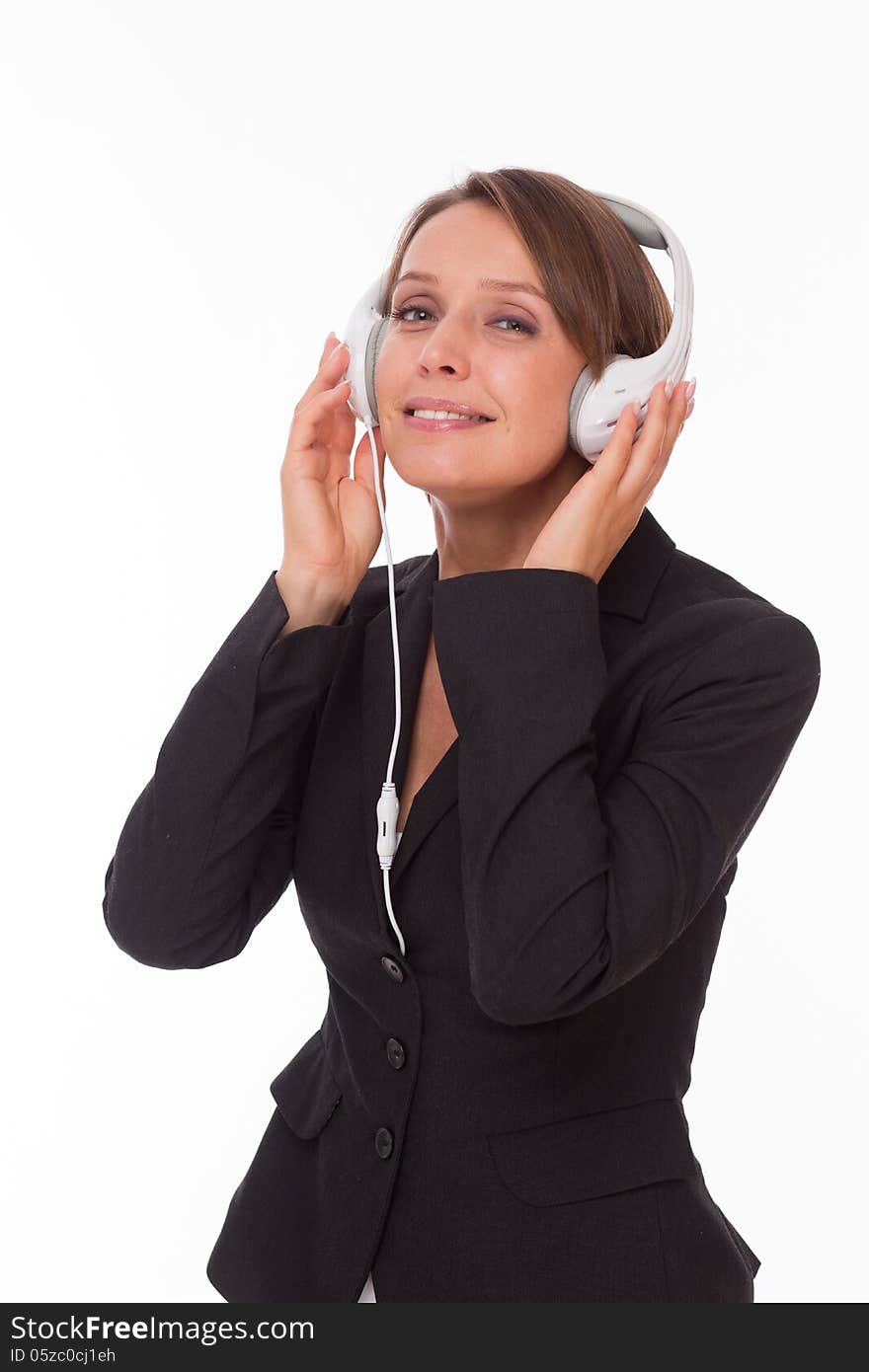 Businesswoman with earphones smiling isolated on white. Businesswoman with earphones smiling isolated on white