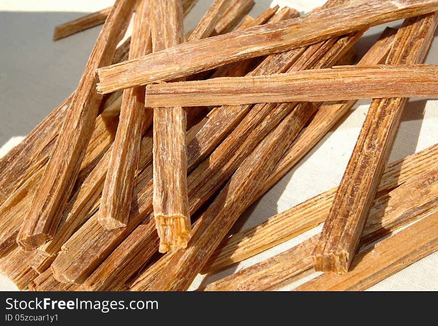 Loose tinder wood on a piece of white cloth. Tinder wood is very dry wood used as kindling for camp fires.