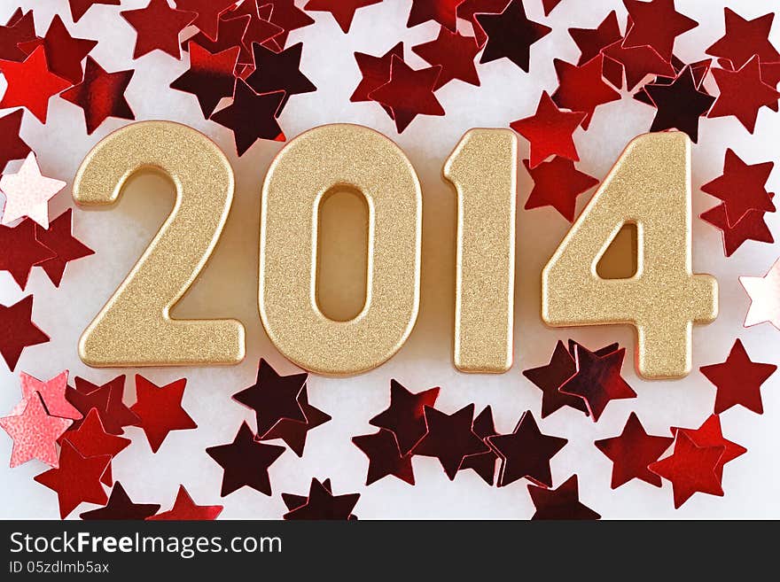 2014 year golden figures on the background of red stars