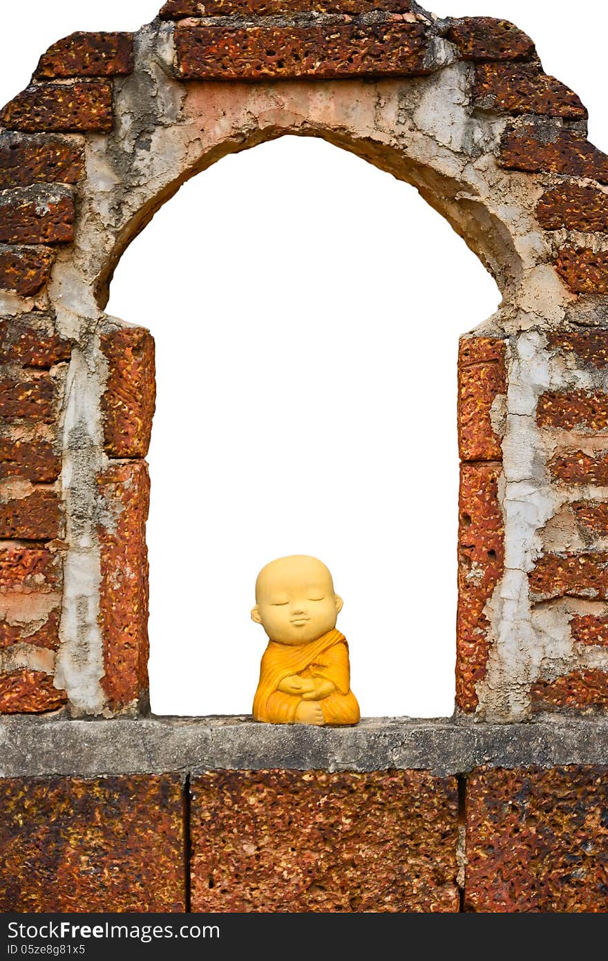 Ceramic thai monk sitting on the ancient wall