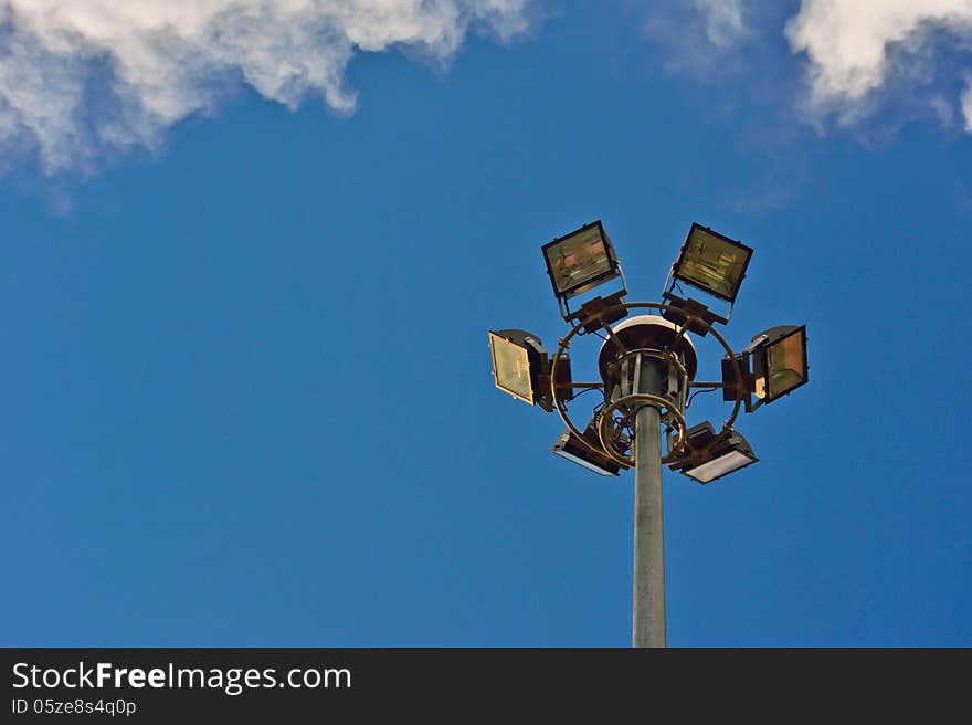 Modern spotlight tower and blue sky in day time. Modern spotlight tower and blue sky in day time