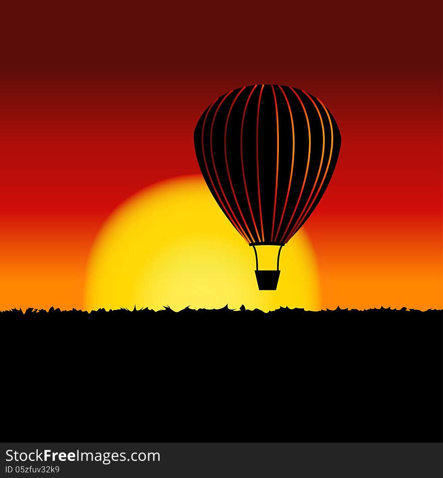 Sunset landscape with air balloon silhouette.