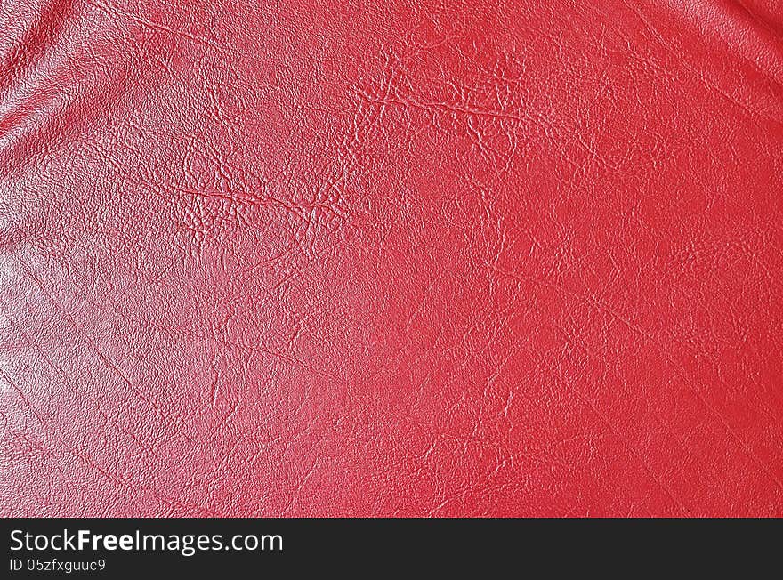 Red leather texture chair close up detail