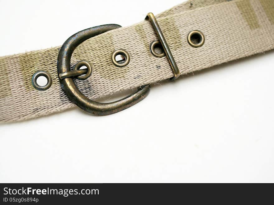 The closeup view of jean belt was taken on white background