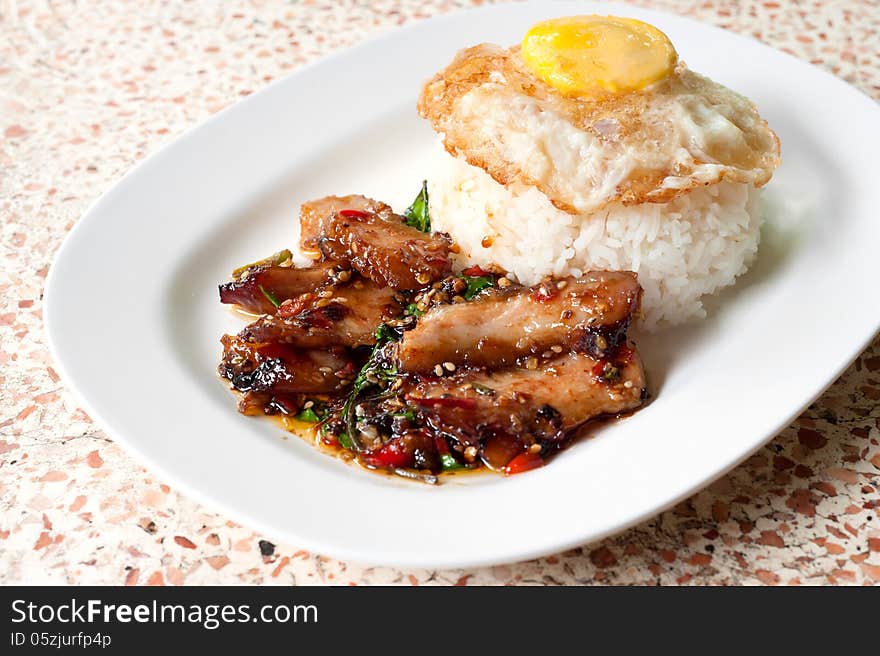 Rice with stir fried hot and spicy pork with basil