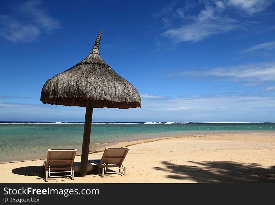 A beautiful seaview in Mauritius and there some chairs in the beach for relaxing. A beautiful seaview in Mauritius and there some chairs in the beach for relaxing