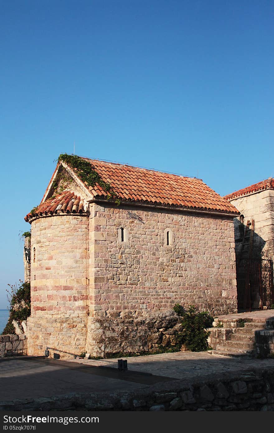 Facade of the medieval building of Romanesque style (18th century). In most cases it was used as an ammunition dump and a defensive tower. Thickness of the wall is 1 meter. Facade of the medieval building of Romanesque style (18th century). In most cases it was used as an ammunition dump and a defensive tower. Thickness of the wall is 1 meter.