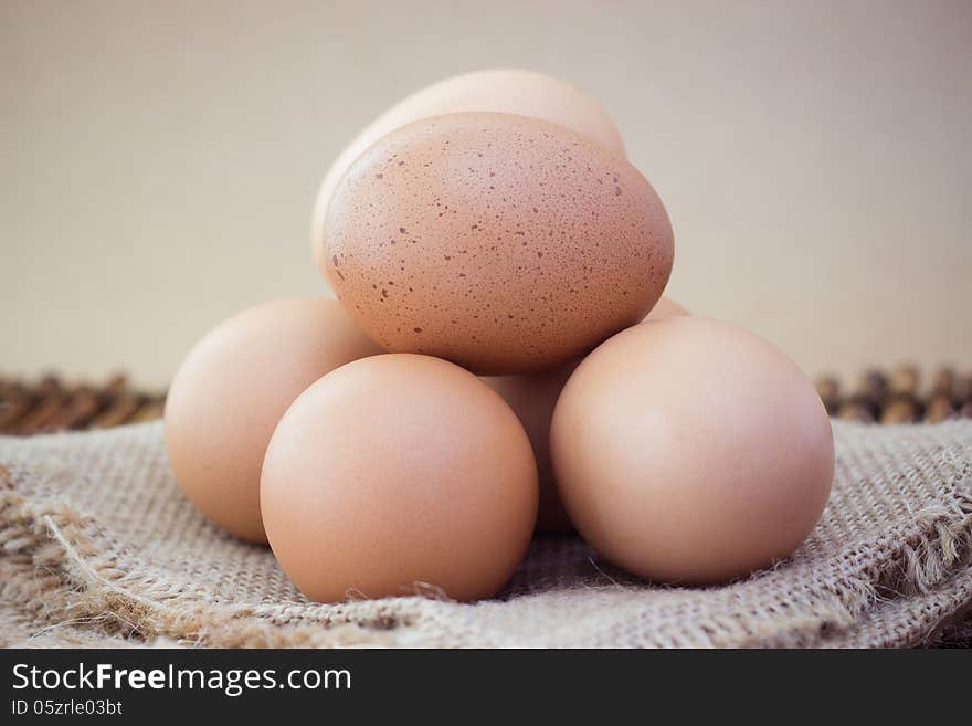 Five eggs isolated on Brown background